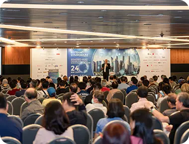 Speaker presenting REIT investment insights at REITs Symposium